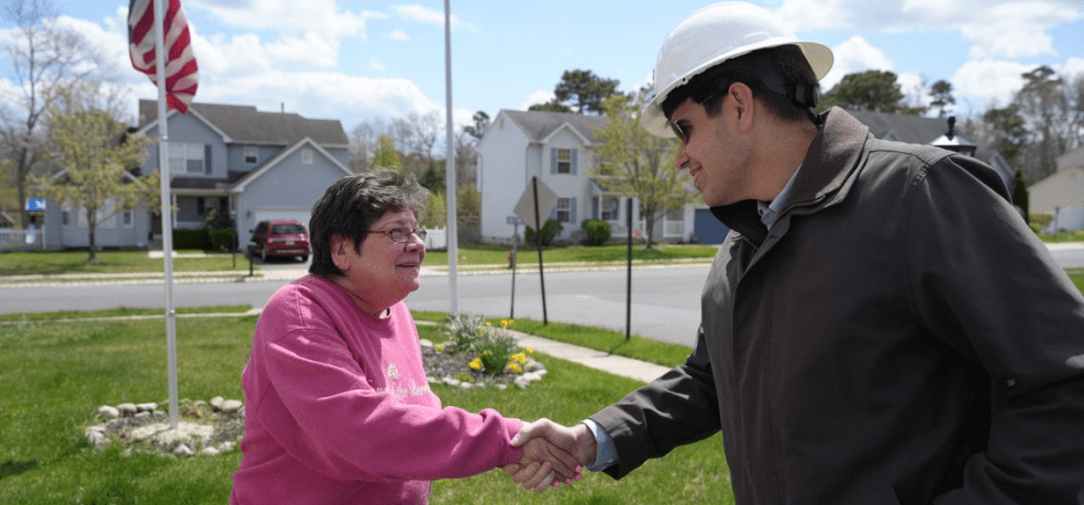 worker shaking hands with customer