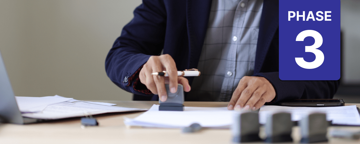 County employee reviews and approves permitting paperwork