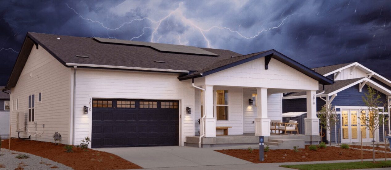 storm with lightning striking behind house