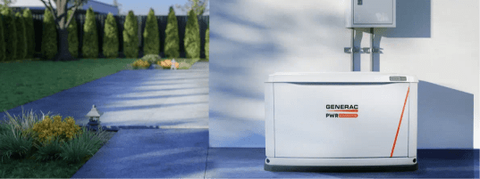 Standby generator next to the corner of a patio